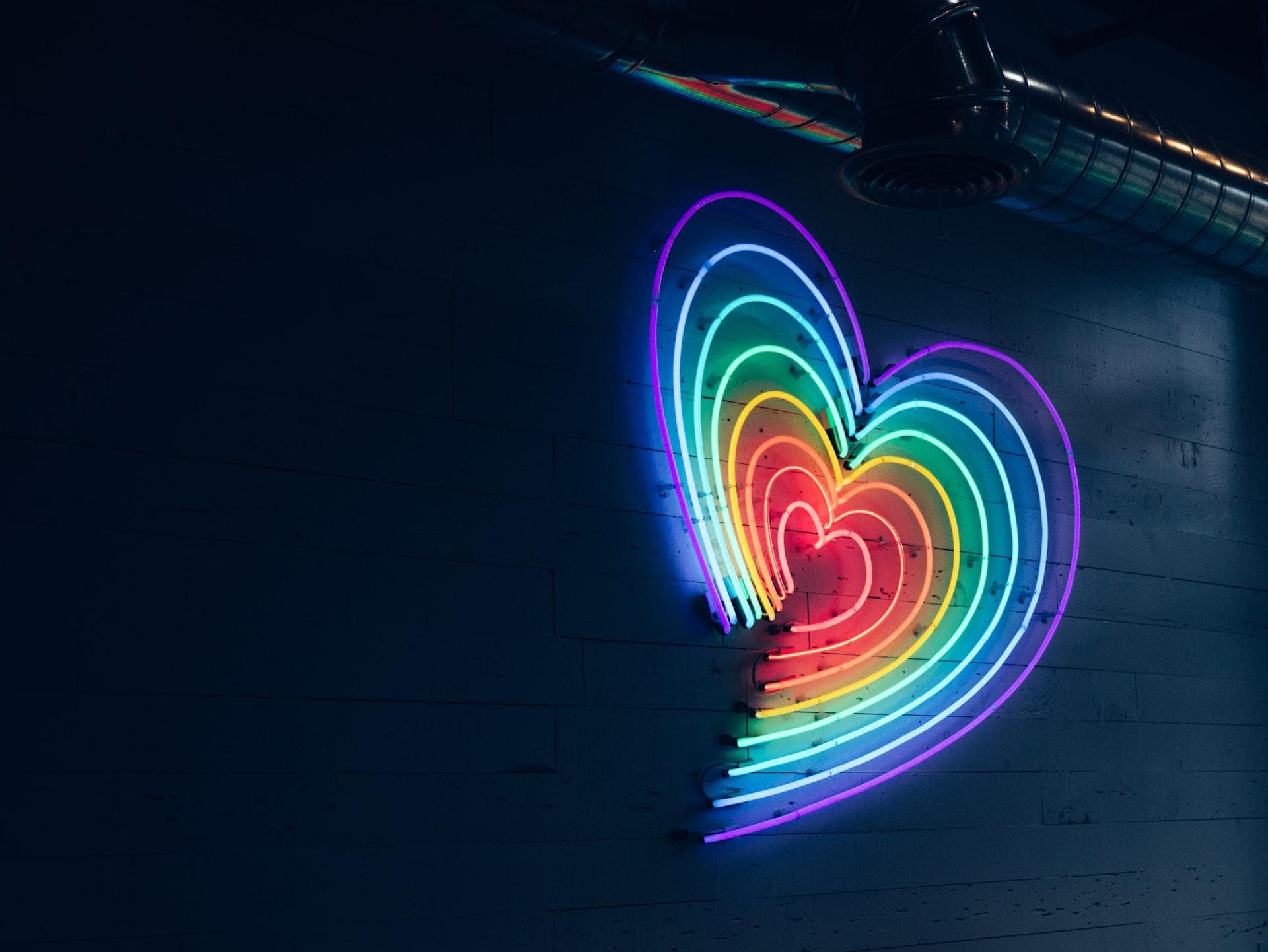 Rainbow colored heart made out of lights