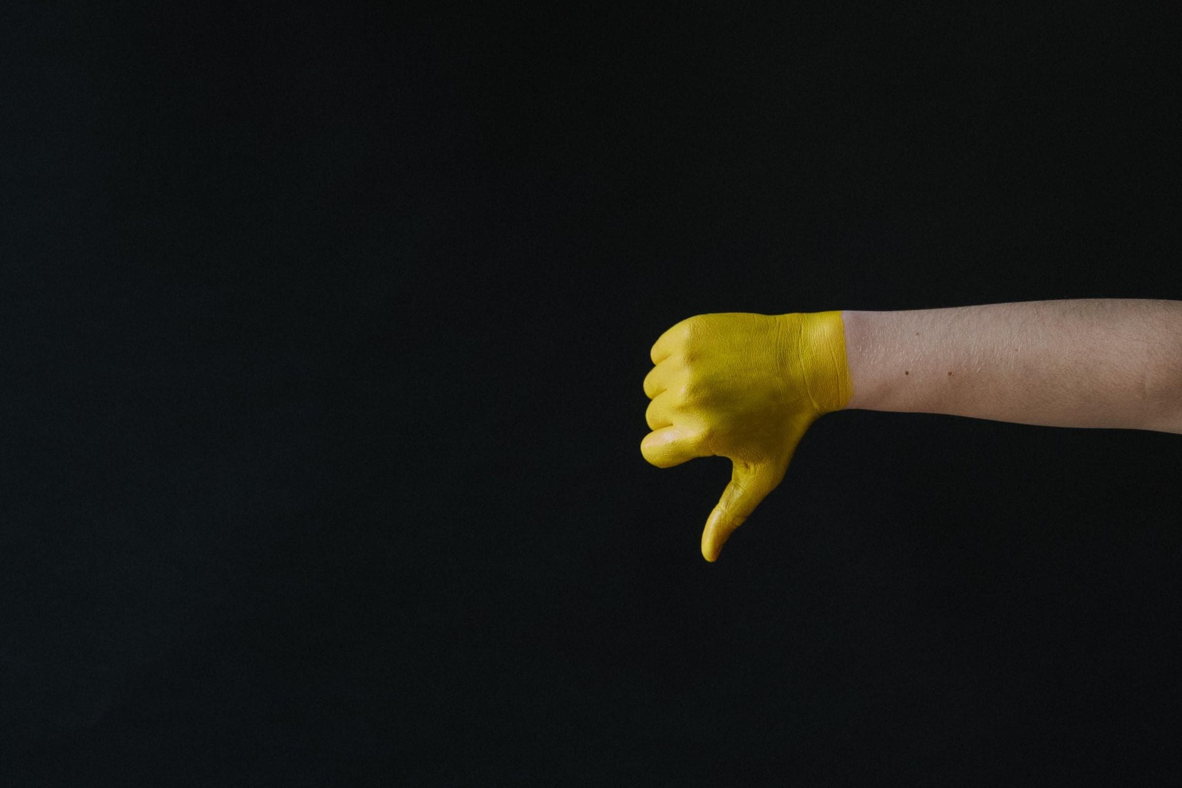 Yellow hand thumbs down