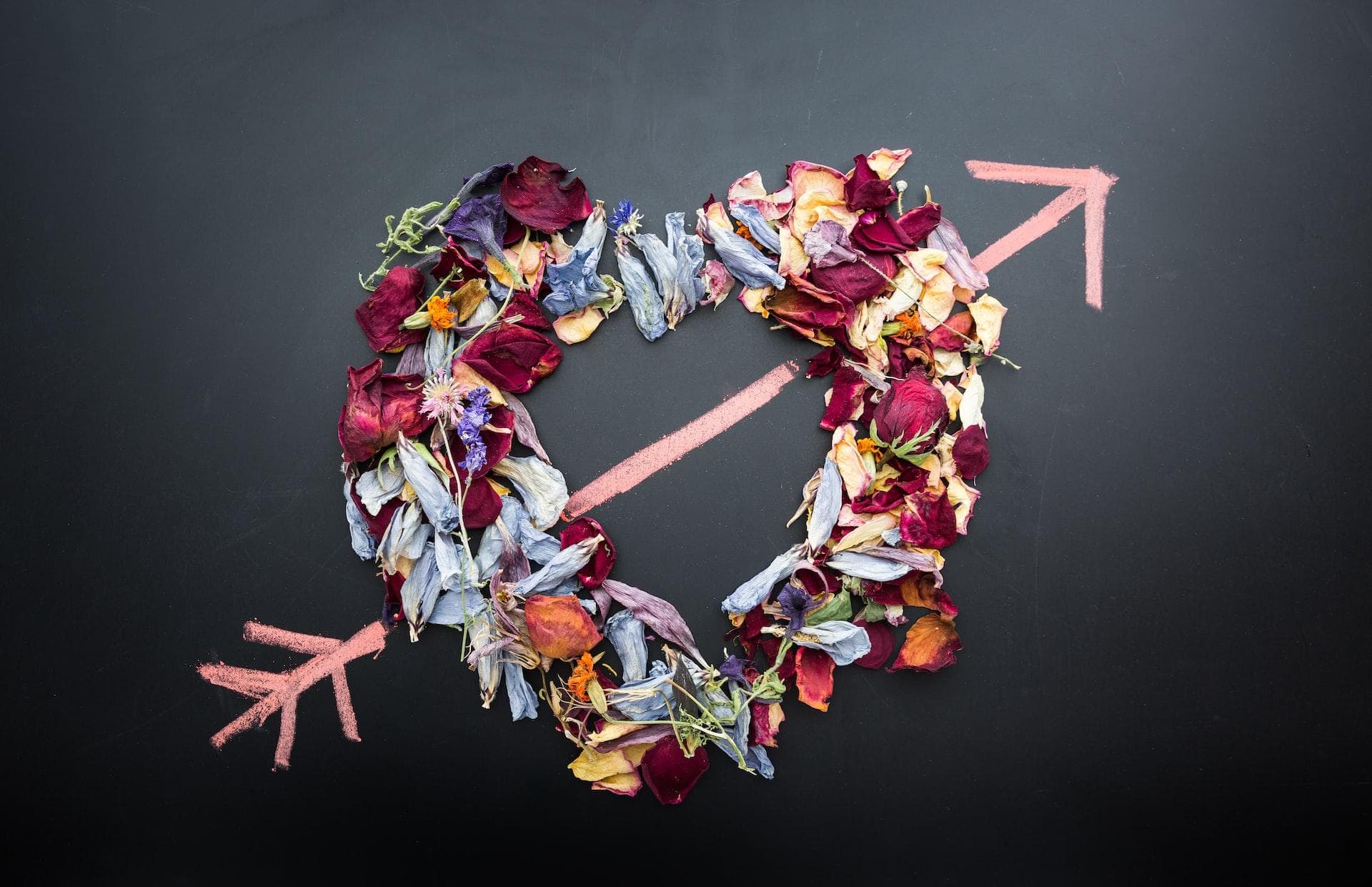 Cupids arrow going through a wreath