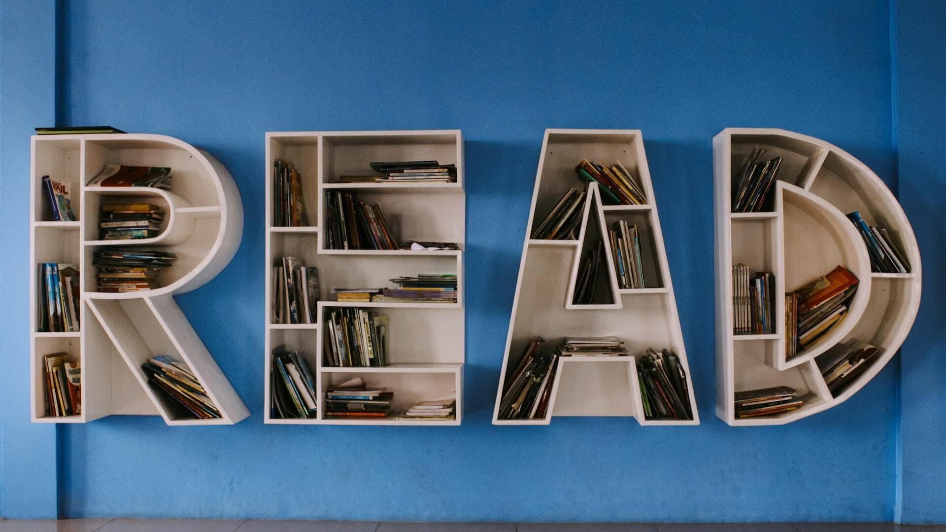 The word 'READ' spelled out as a bookshelf